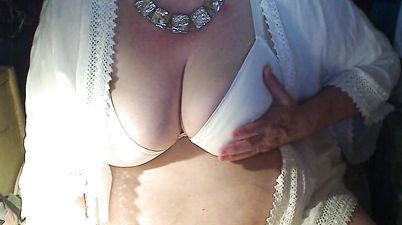 Mature Lady Shows Her Giant Boobs On Camera
